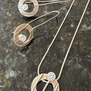 Necklace and earrings g set with silver and cz